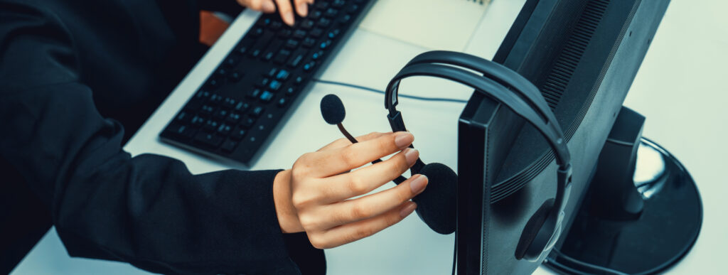 Call center wearing headset working in office for customer support oratory